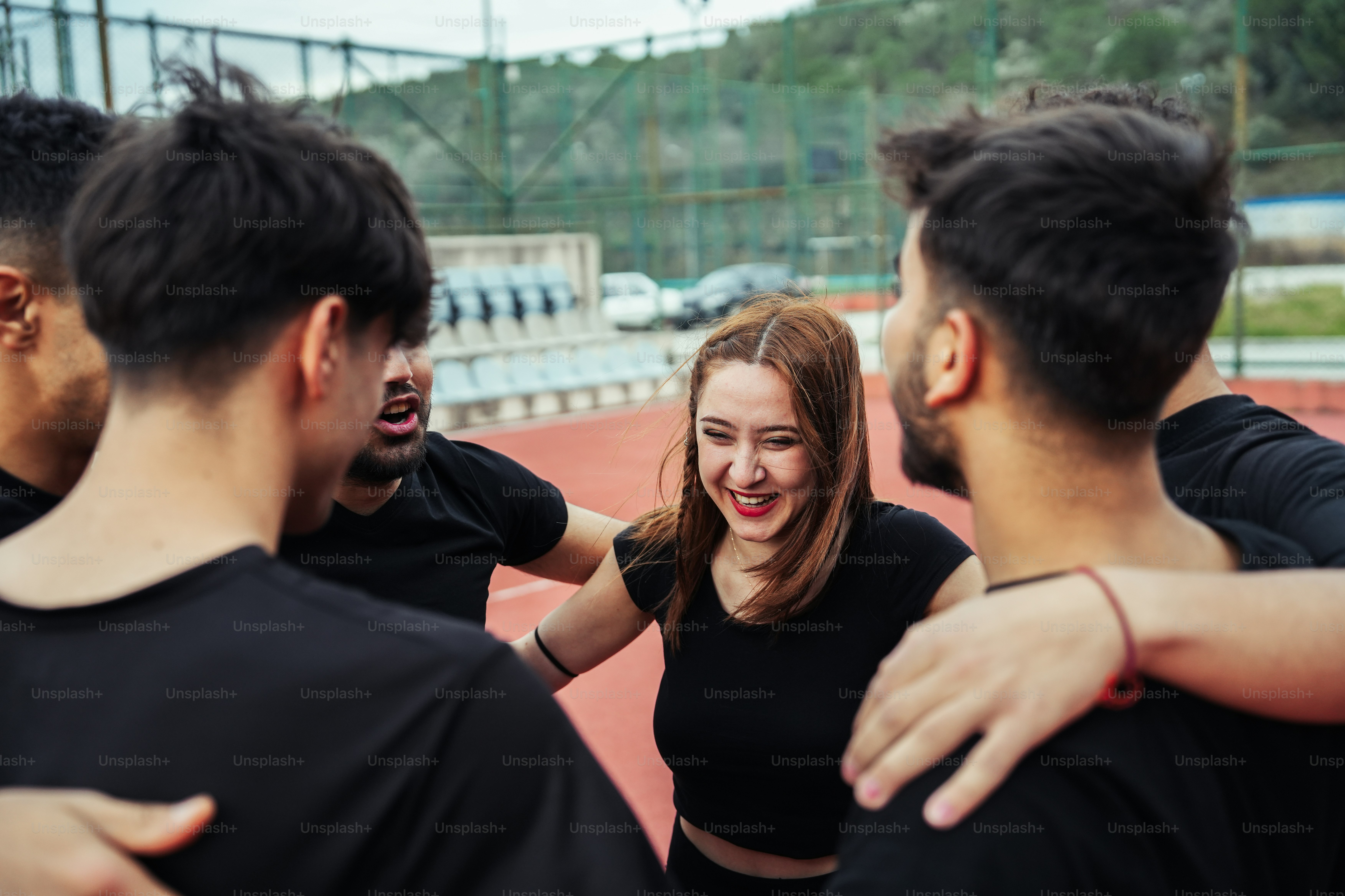 a group of young people standing around each other