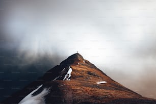 a tall mountain with snow on top of it