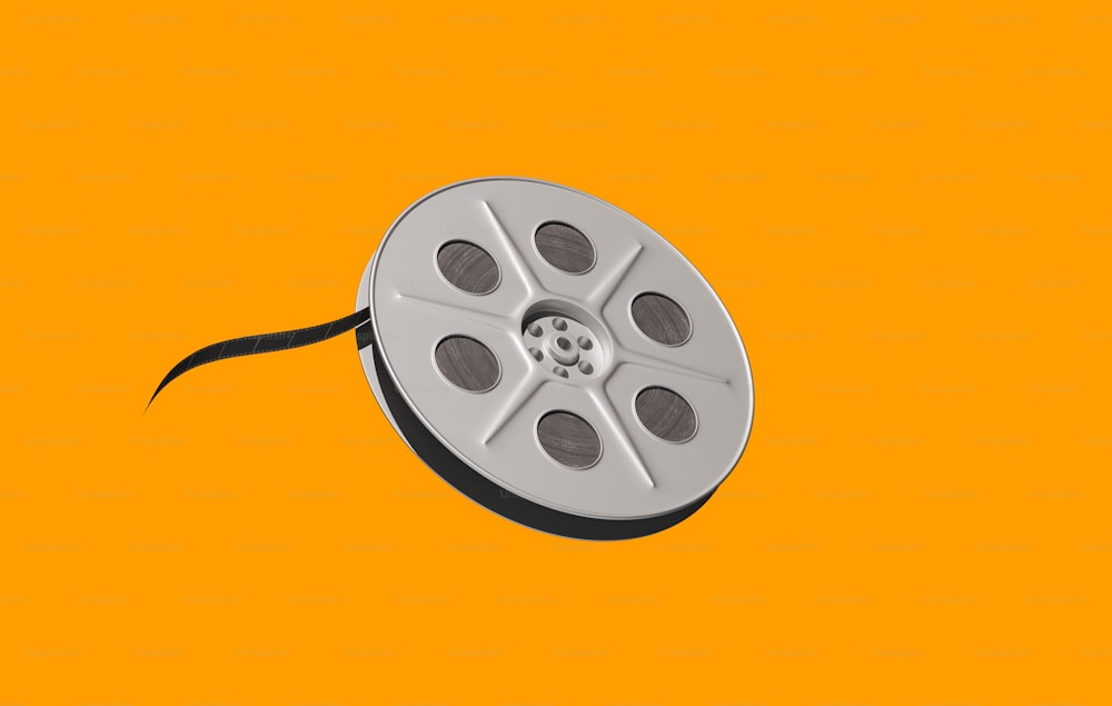 a reel of film on a yellow background