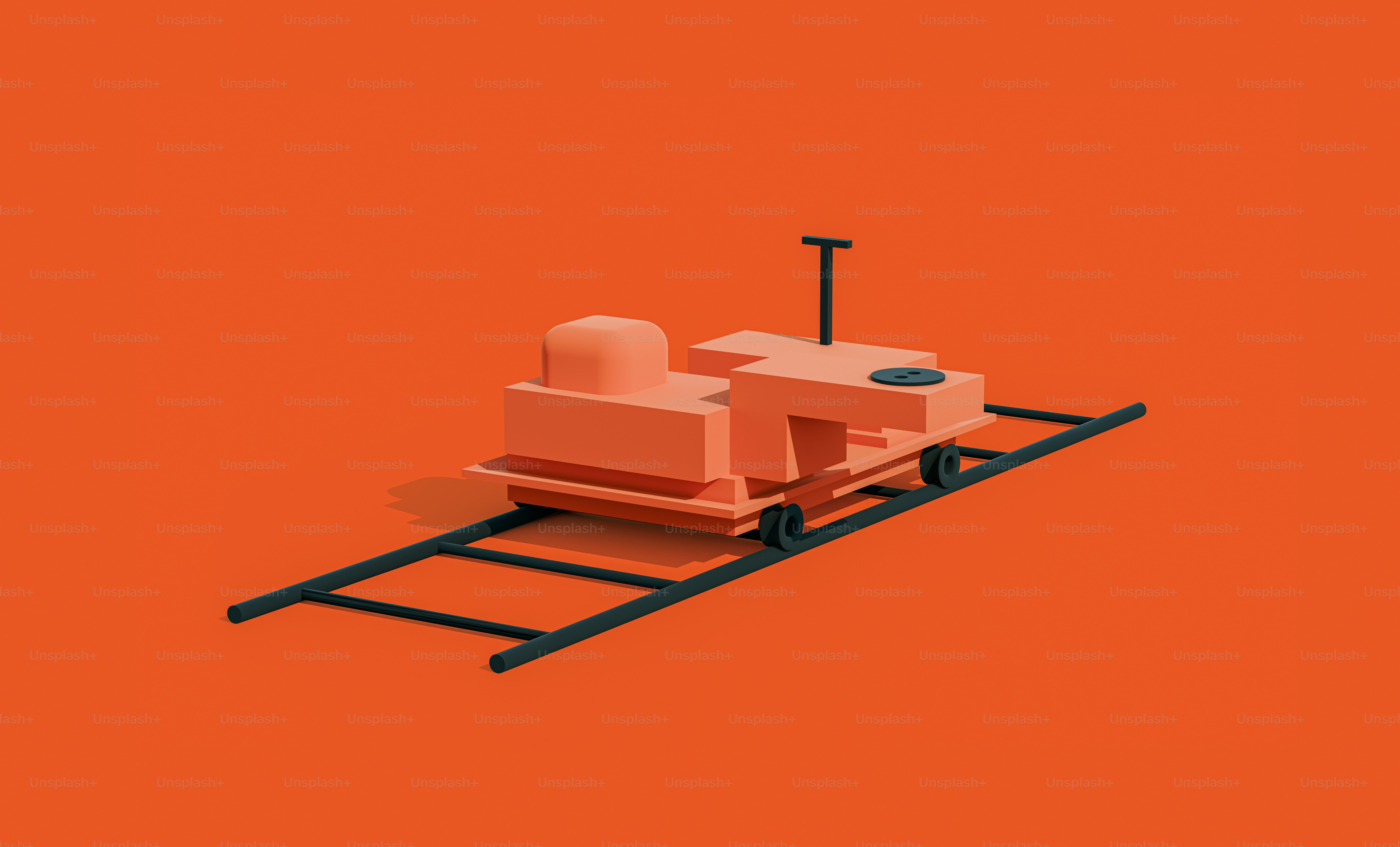 an orange background with a toy train on the tracks