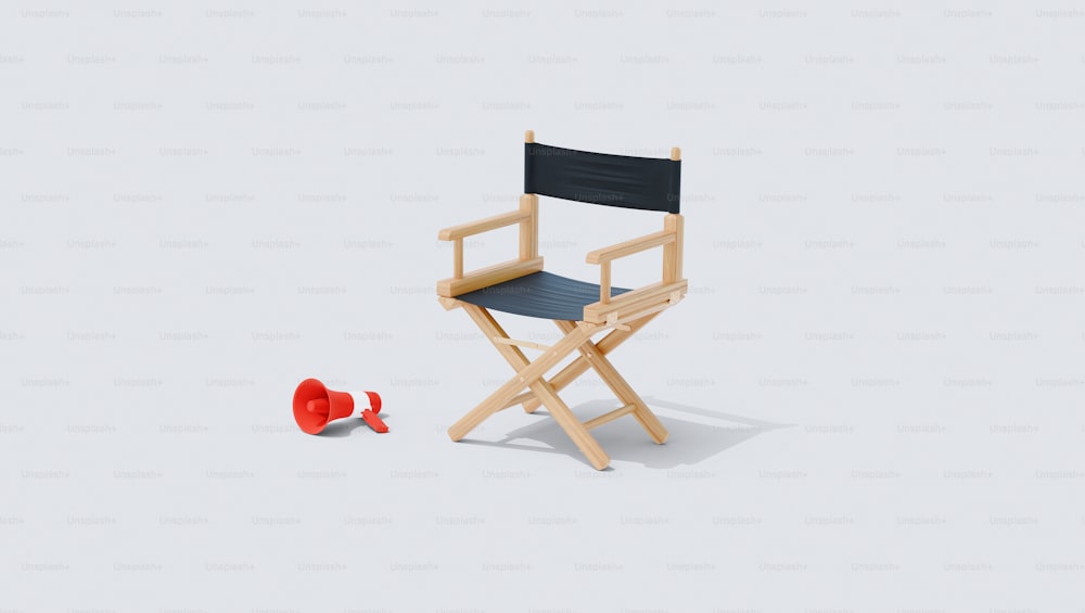 ein Holzstuhl und eine rote Tasse auf weißem Hintergrund