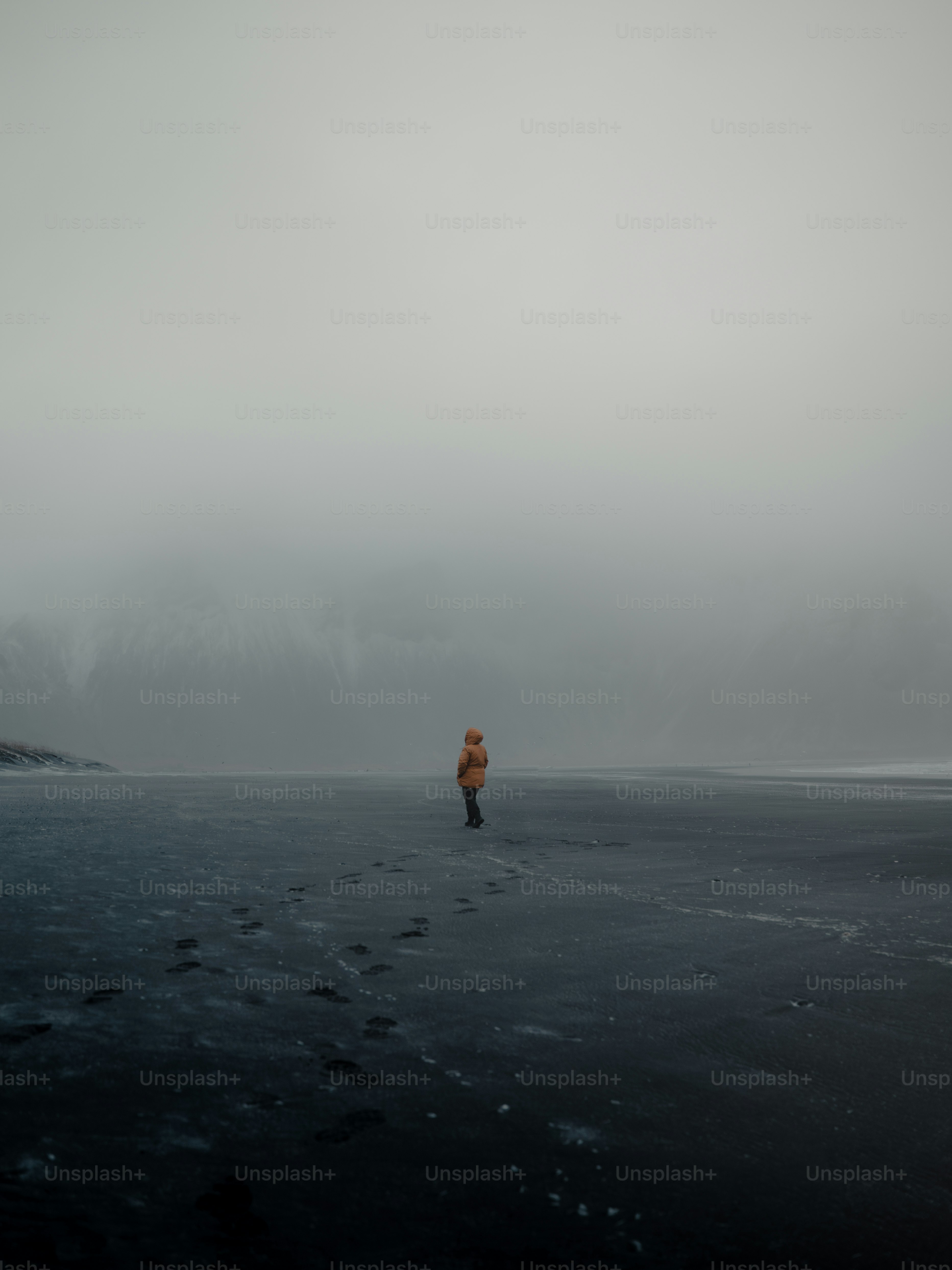a person standing in the middle of a body of water