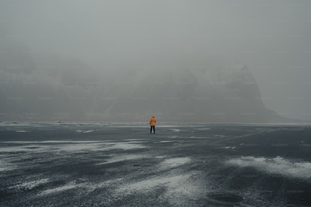 a person standing in the middle of a large body of water