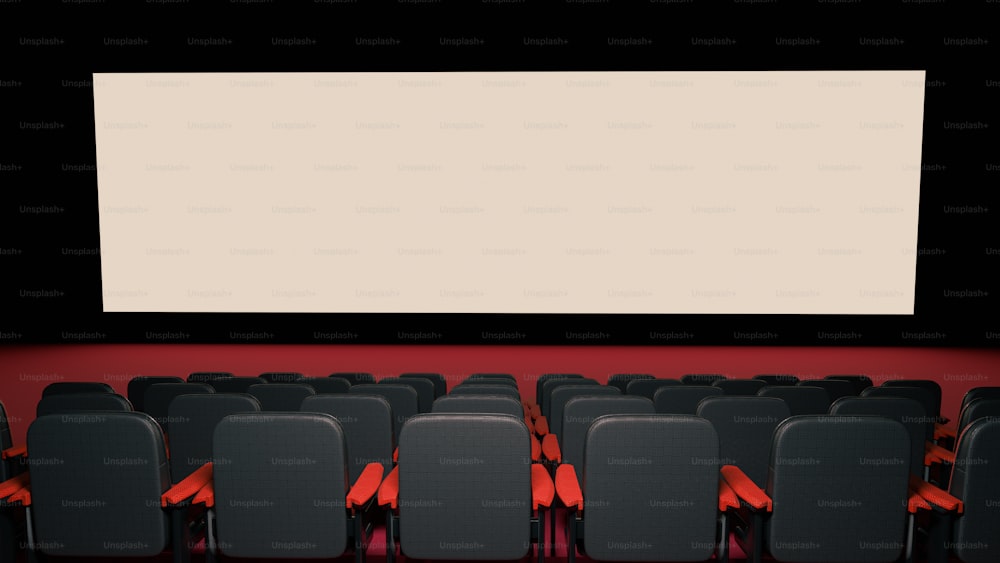 a row of empty chairs in front of a large screen