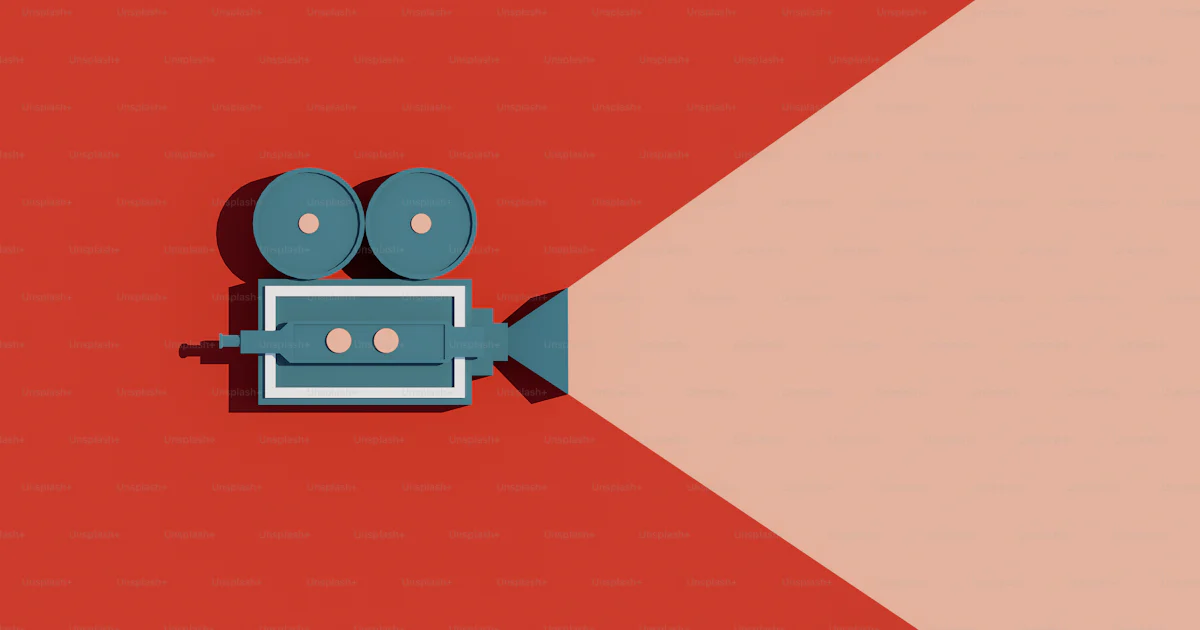 An overhead view of a movie camera on a red and pink background photo ...