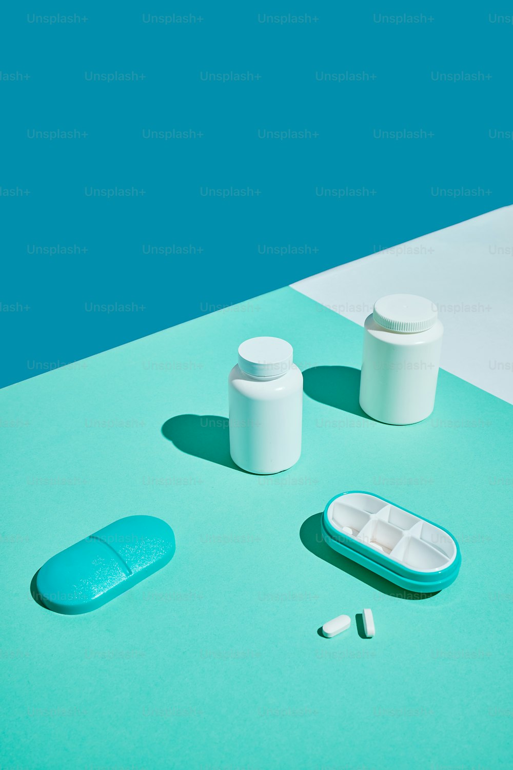 pills and a pill bottle on a table