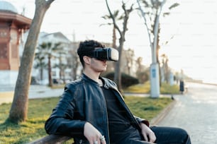 a man sitting on a bench wearing a pair of virtual glasses