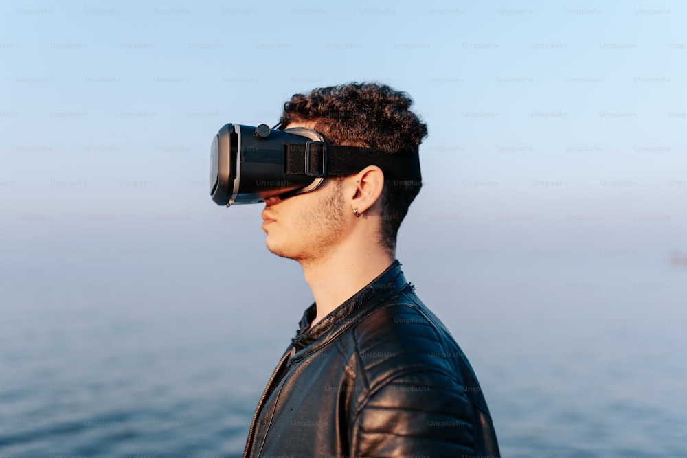 a man in a leather jacket wearing a pair of virtual glasses
