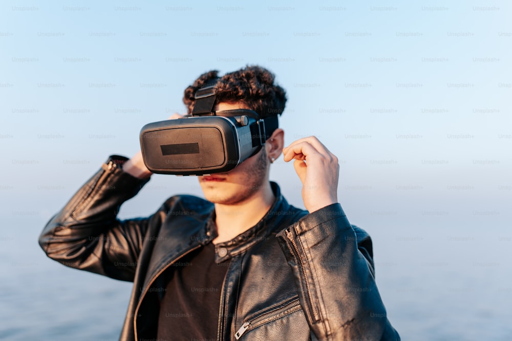 a man wearing a leather jacket and a pair of virtual glasses