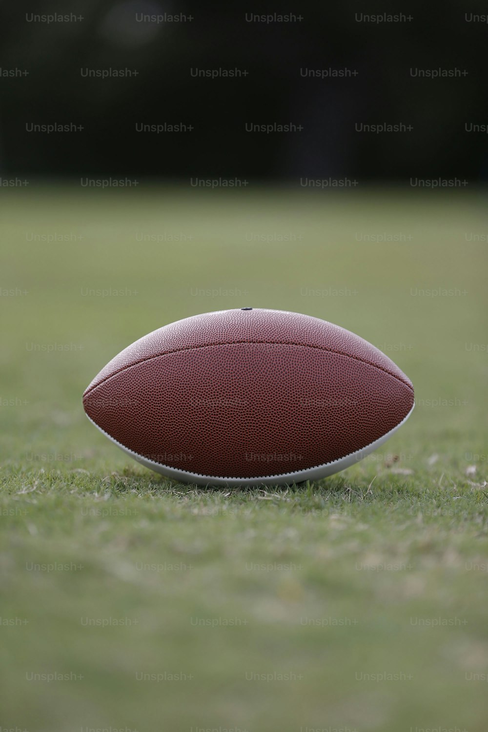 a close up of a football on a field