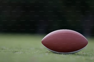 a close up of a football on a field