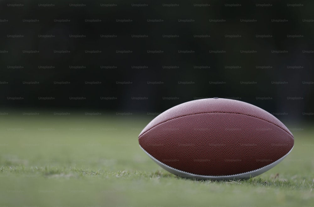a close up of a football on a field