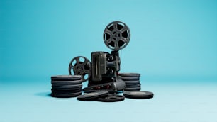 a film projector sitting on top of a pile of discs