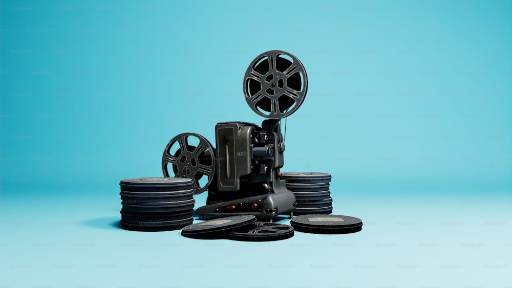 a film projector sitting on top of a pile of discs