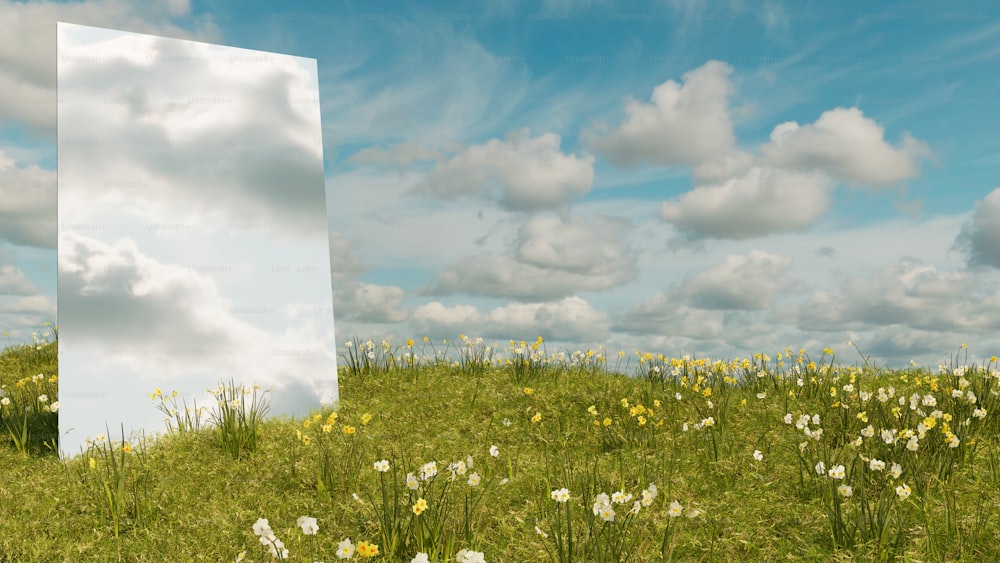 a large white box sitting in the middle of a field