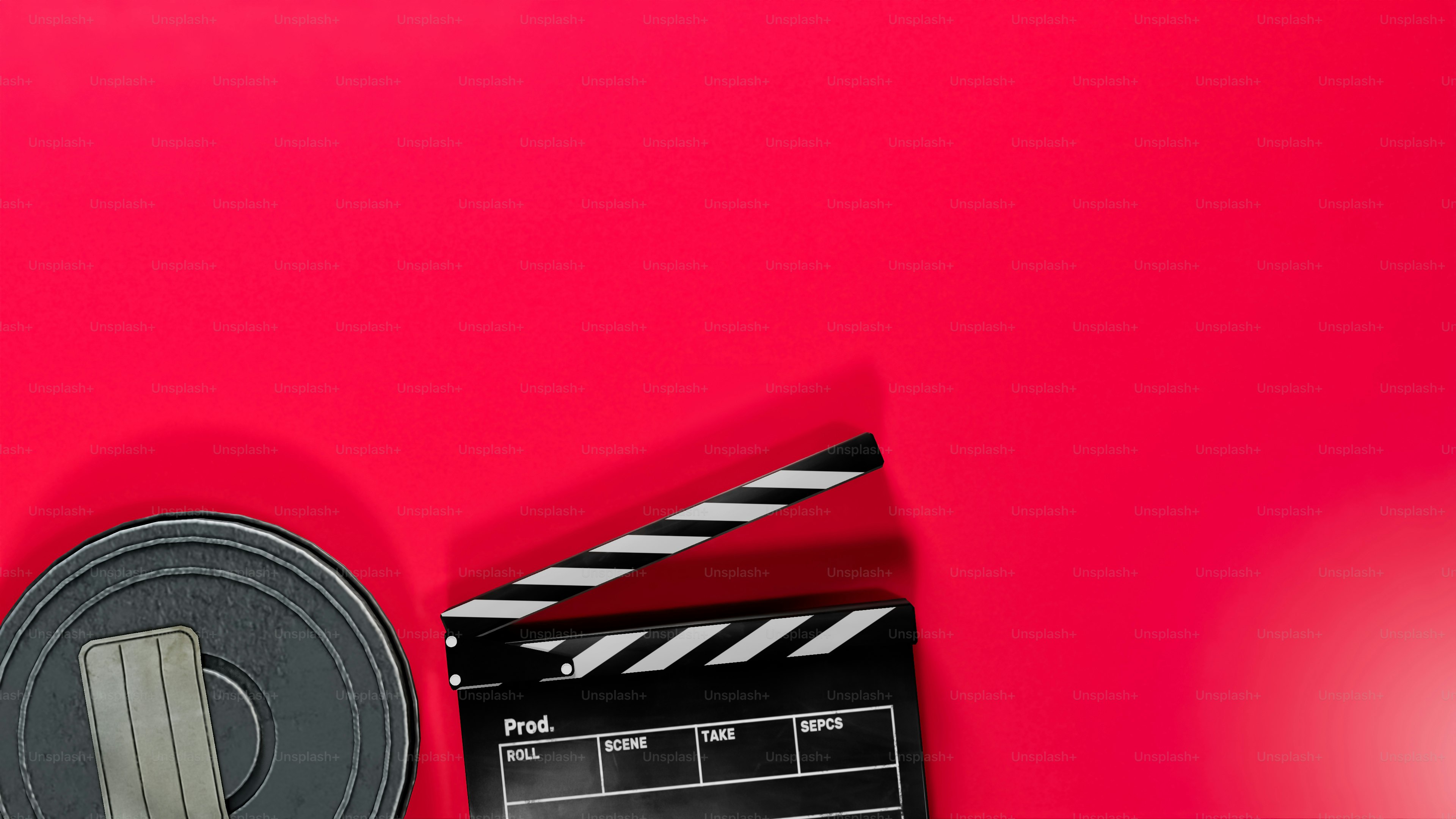 a movie clapper and a red background