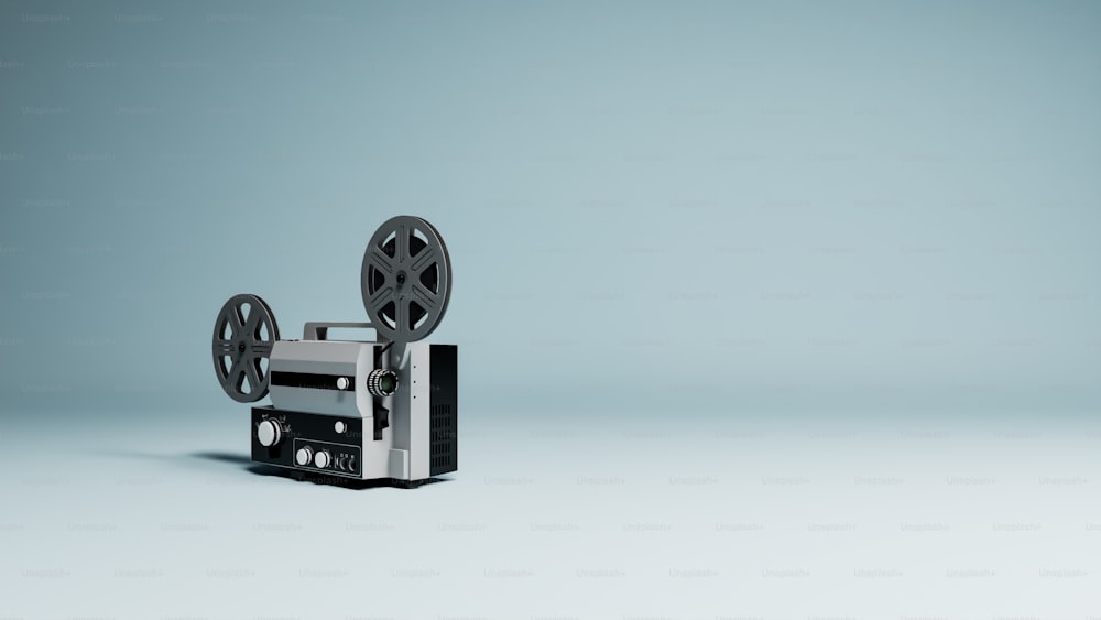 a black and white film projector sitting on top of a table