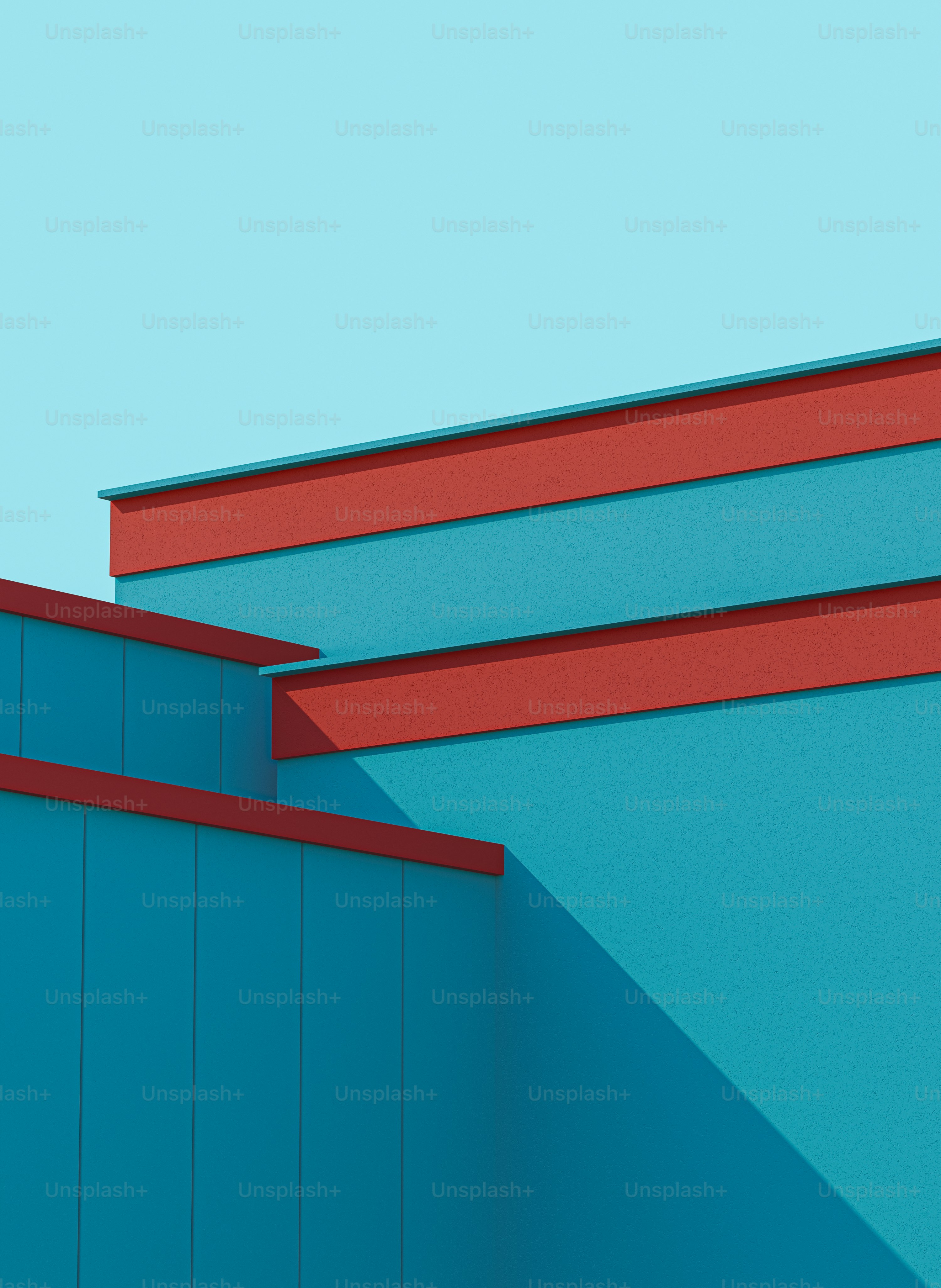 a red and blue building with a clock on it