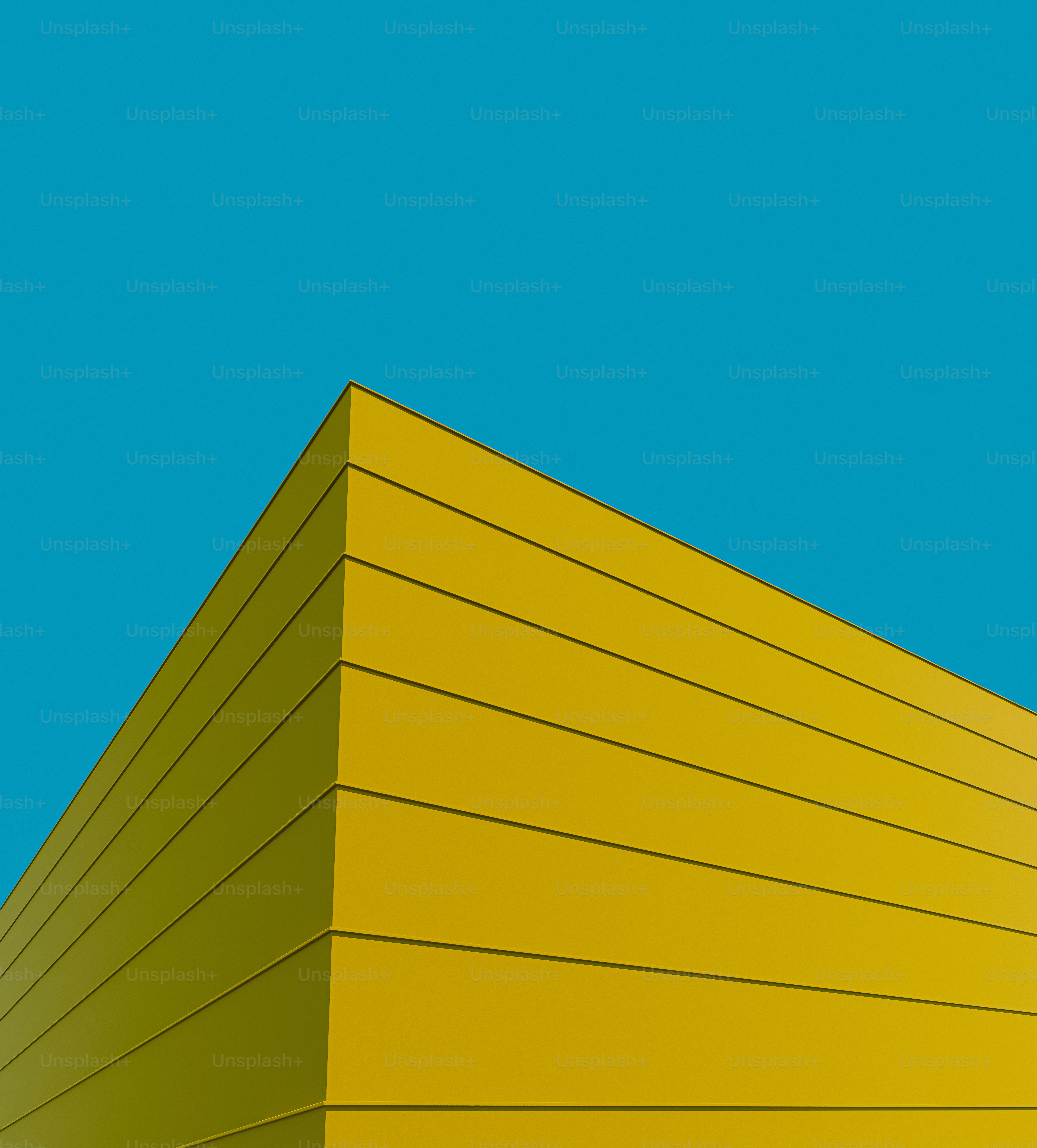 a yellow building with a blue sky in the background