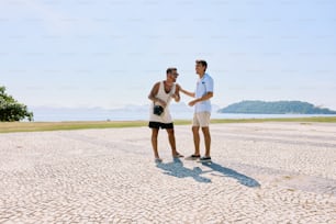 a man and a woman standing on a beach