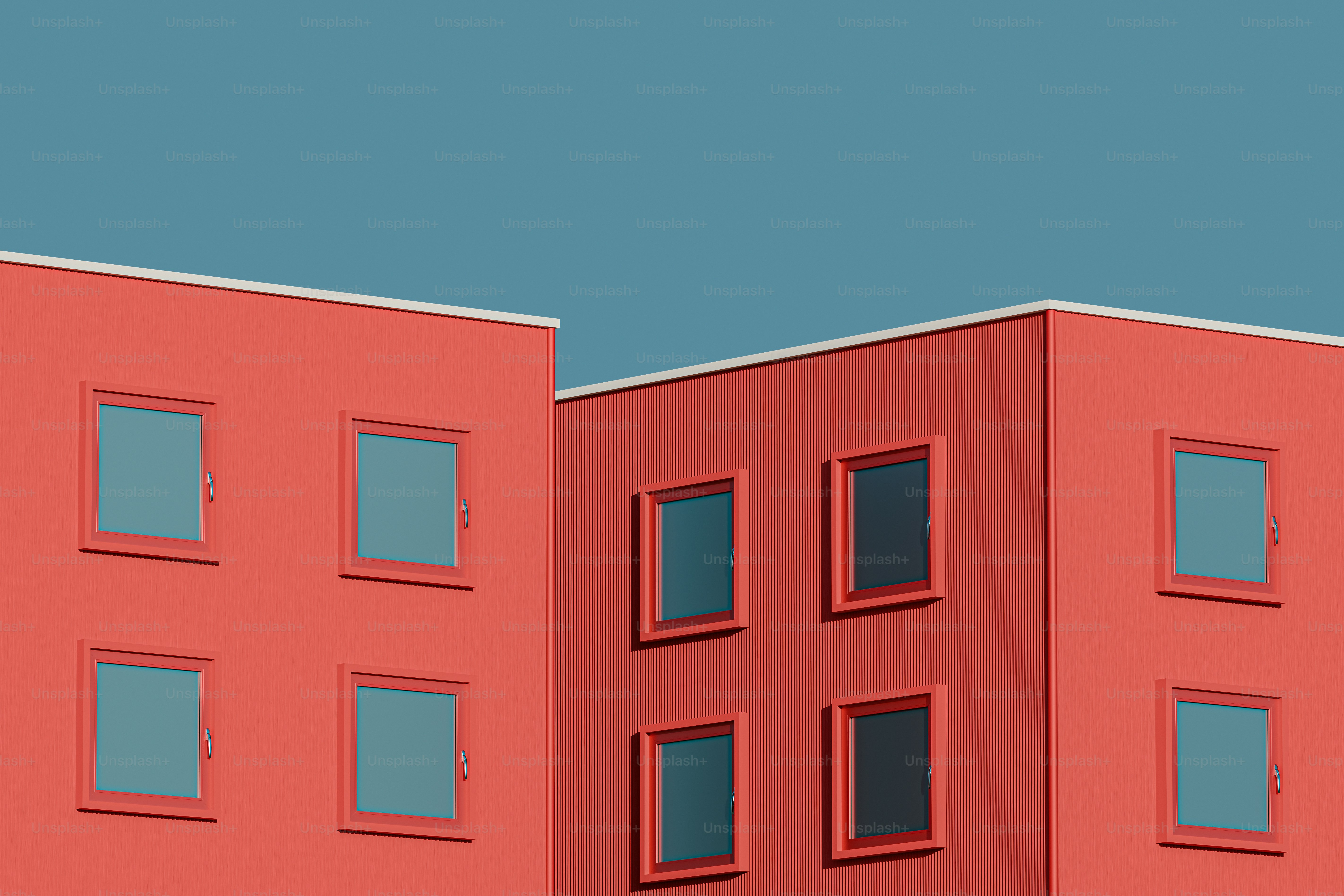 um edifício vermelho com janelas e um relógio ao lado