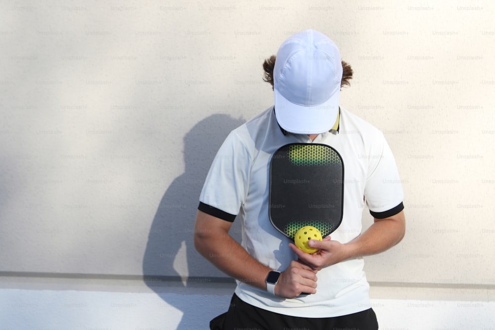 a tennis player holding a racket and ball