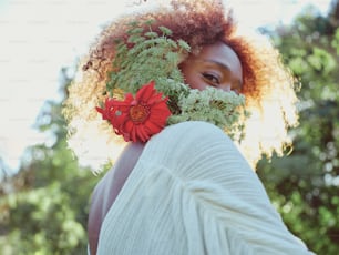 a woman with a flower in her hair