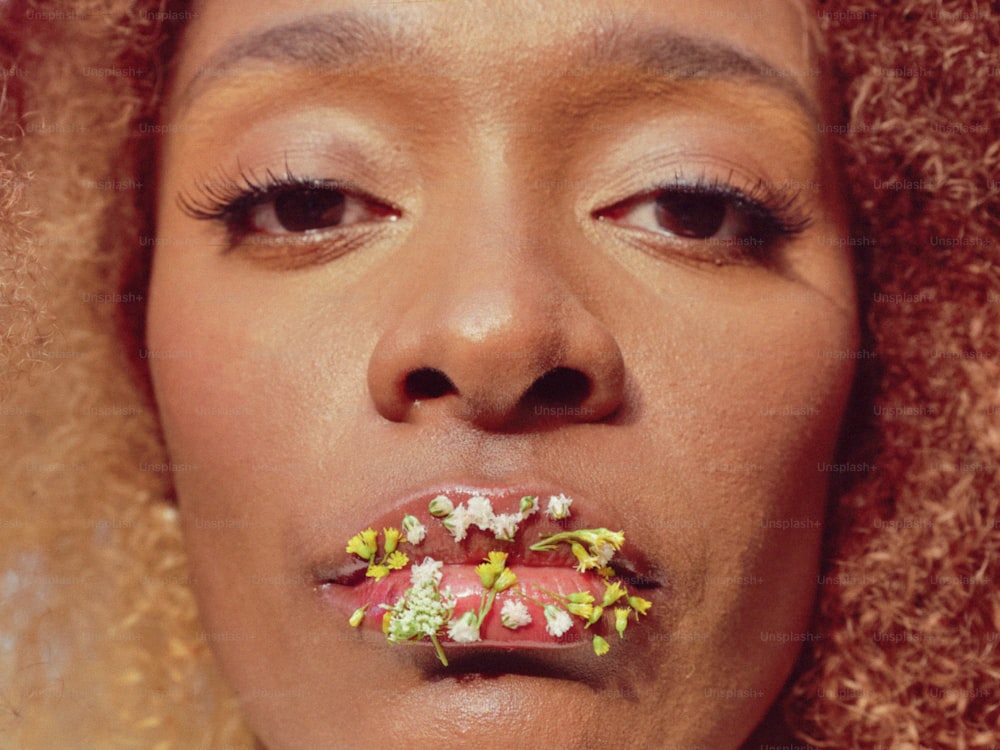 a close up of a person with food in her mouth
