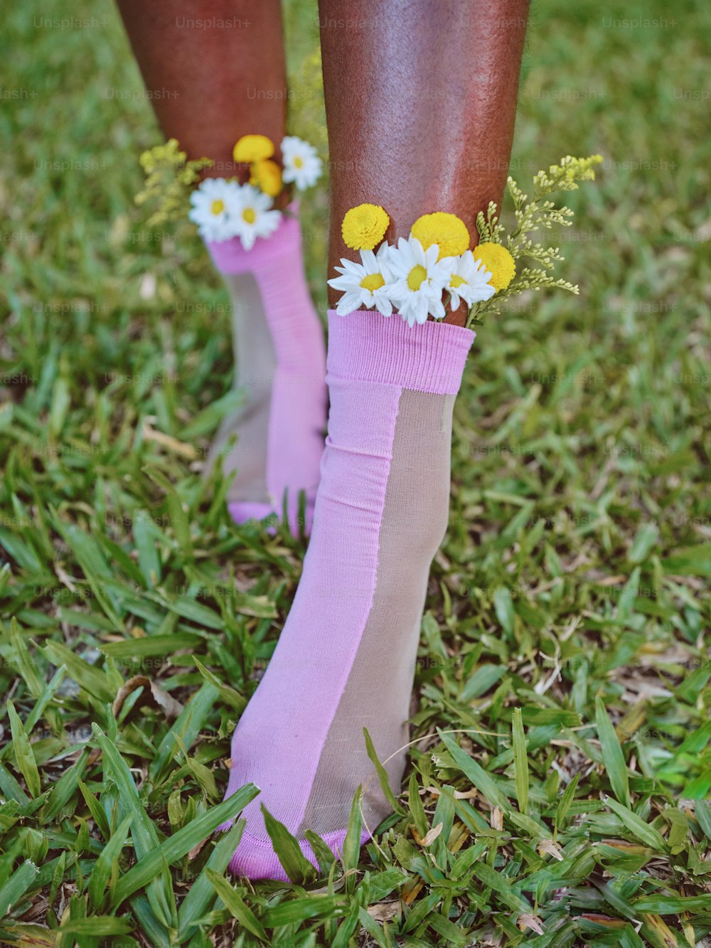 a pair of legs with flowers on them