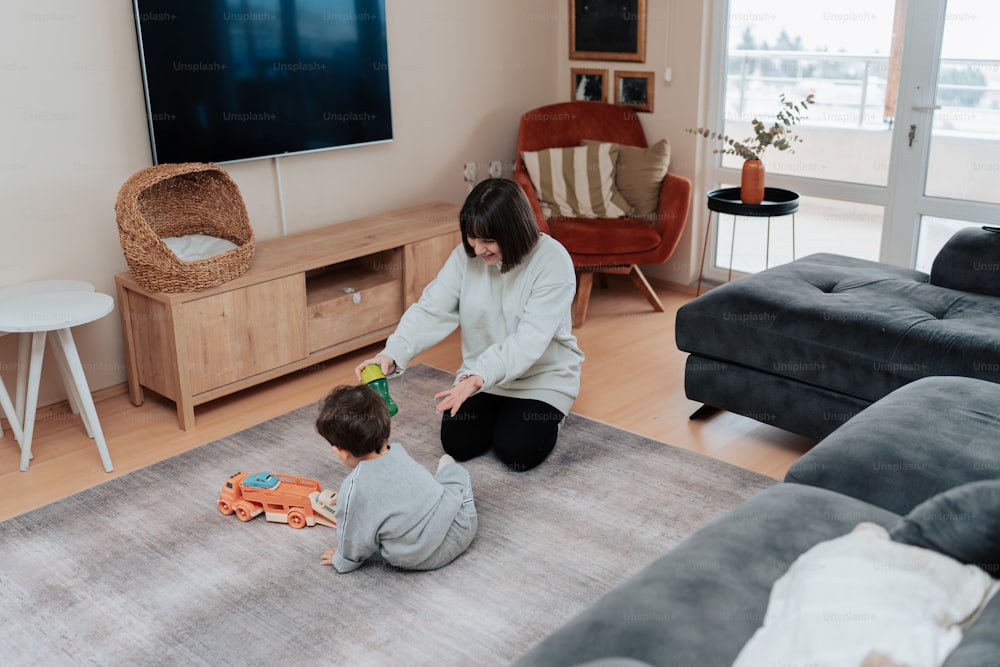 a woman playing with a child in a living room