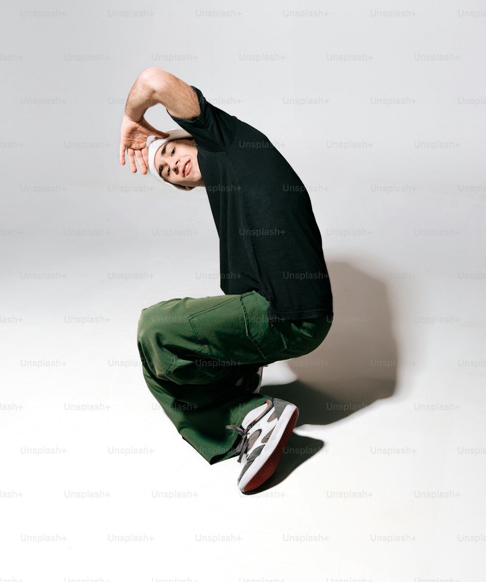 a man in black shirt doing a trick on a skateboard