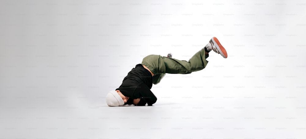 a man doing a handstand on one leg