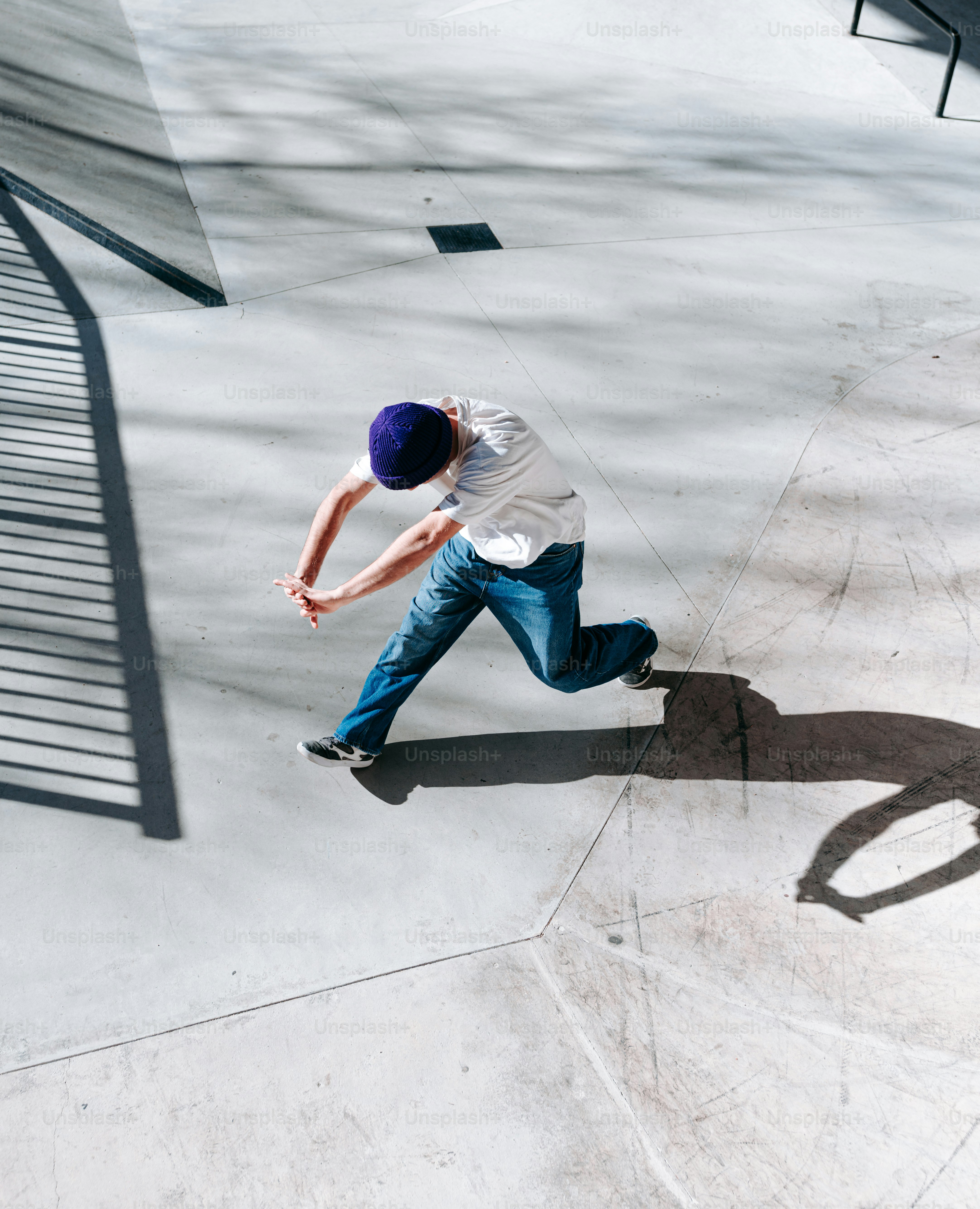 A man riding a skateboard down the side of a ramp photo – Urban Image ...