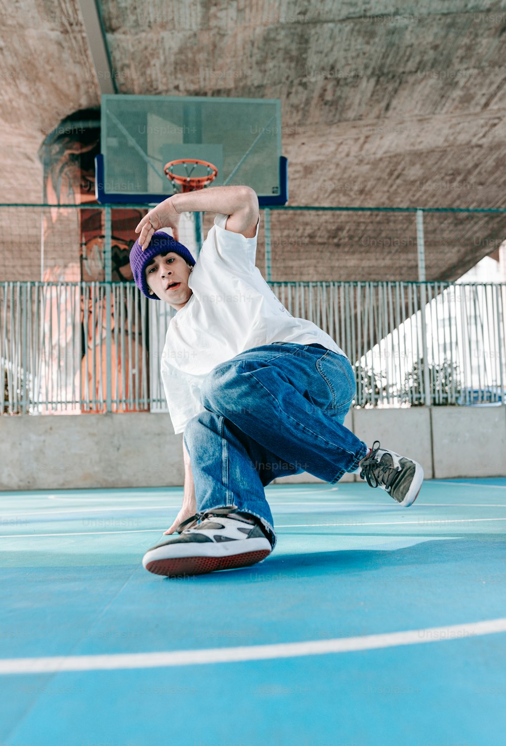 a young man is doing a trick on a skateboard