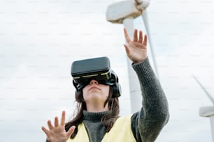 a woman in a yellow vest wearing a virtual reality headset