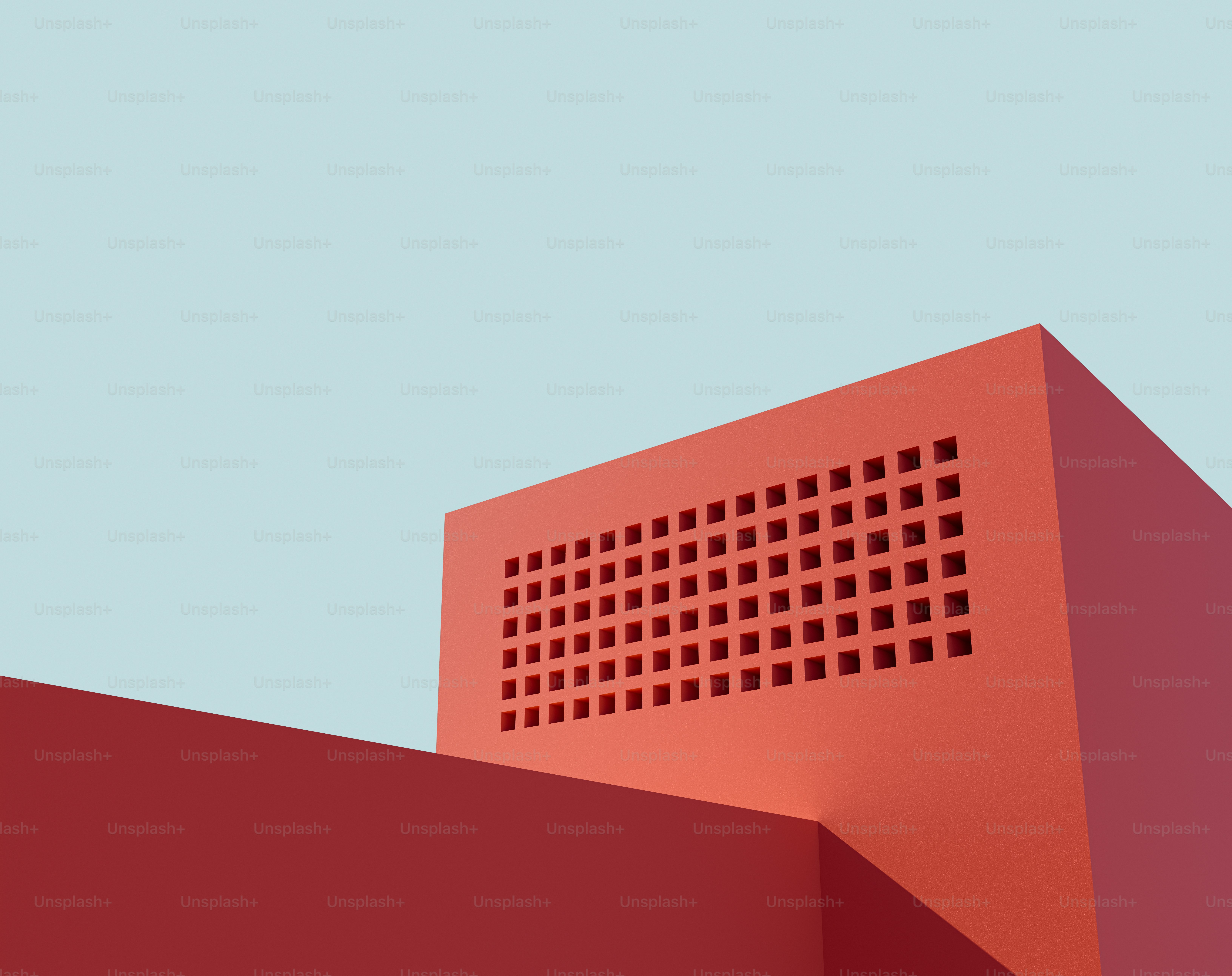 a red building with a blue sky in the background