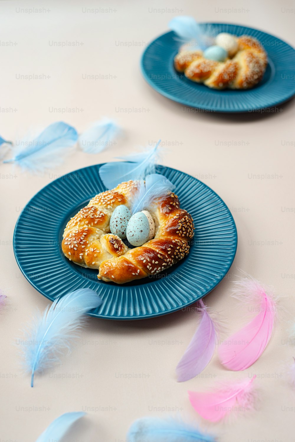 a blue plate topped with a pastry covered in eggs