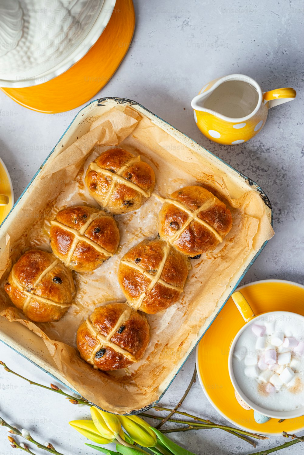 a baking dish filled with hot cross buns