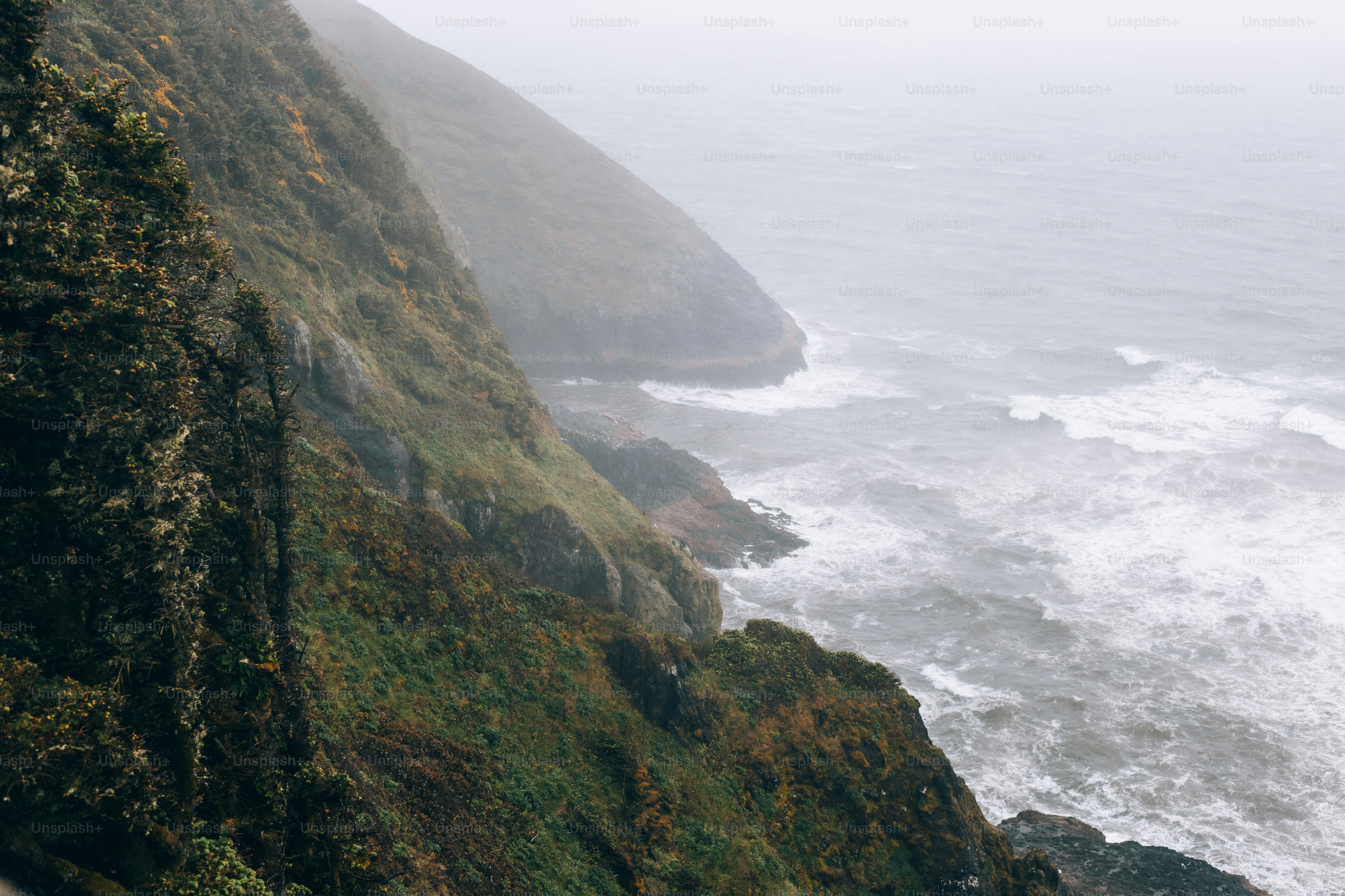 a view of the ocean from the top of a cliff