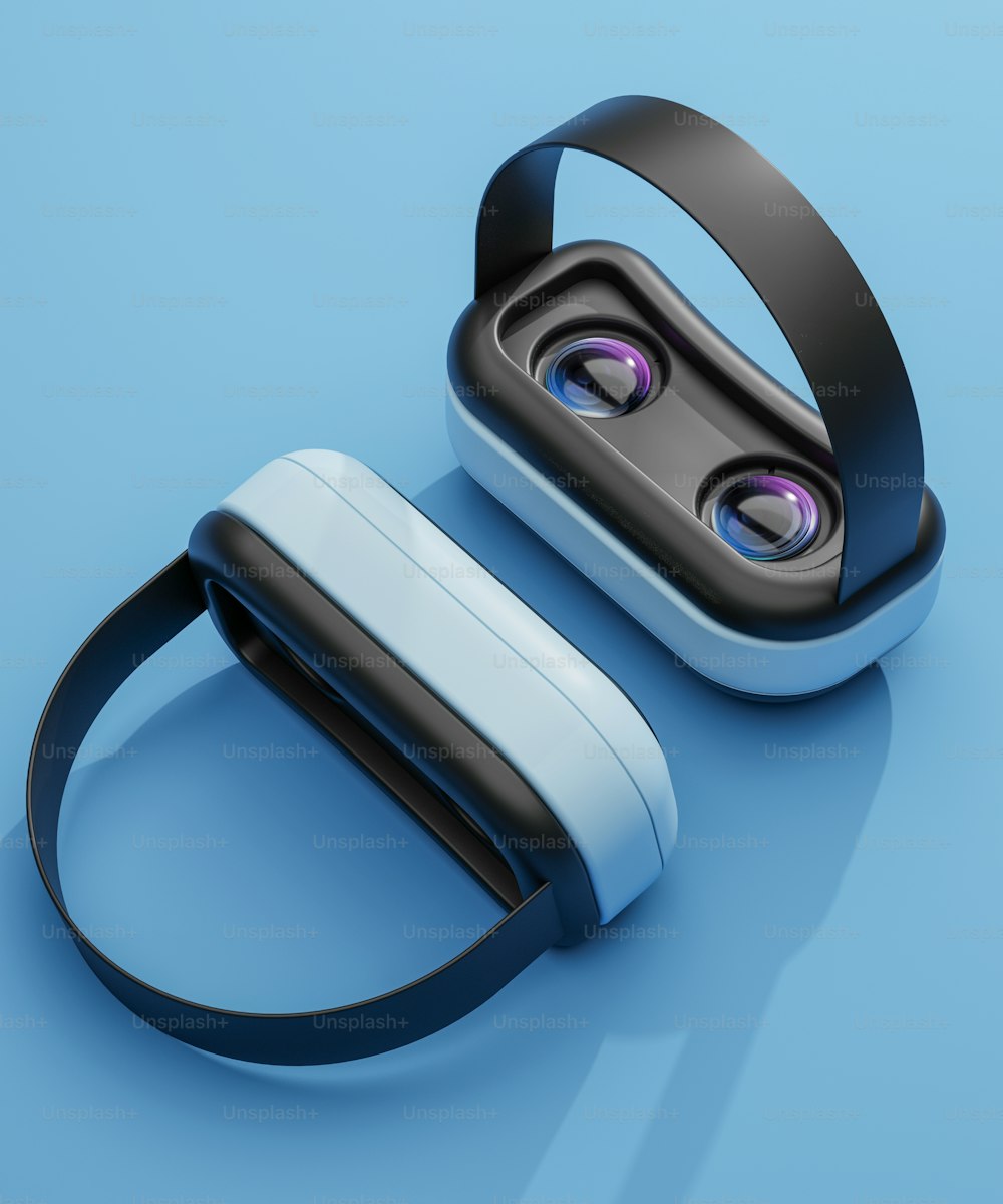 a pair of bluetooth ear buds sitting on top of a blue surface