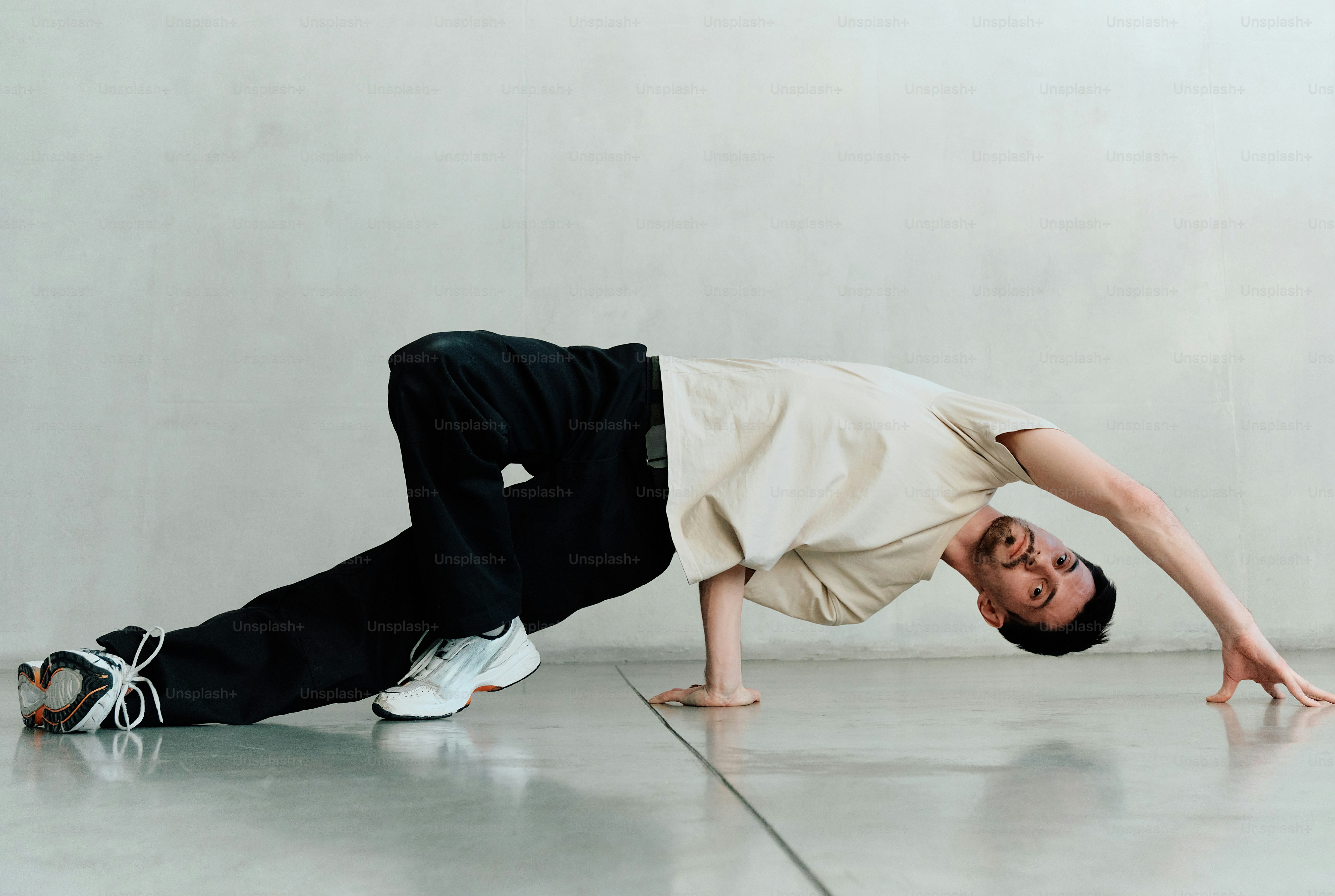 a man is doing a handstand on the floor