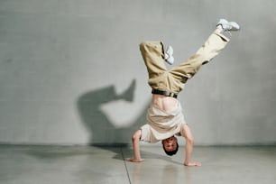 a man doing a handstand in a room