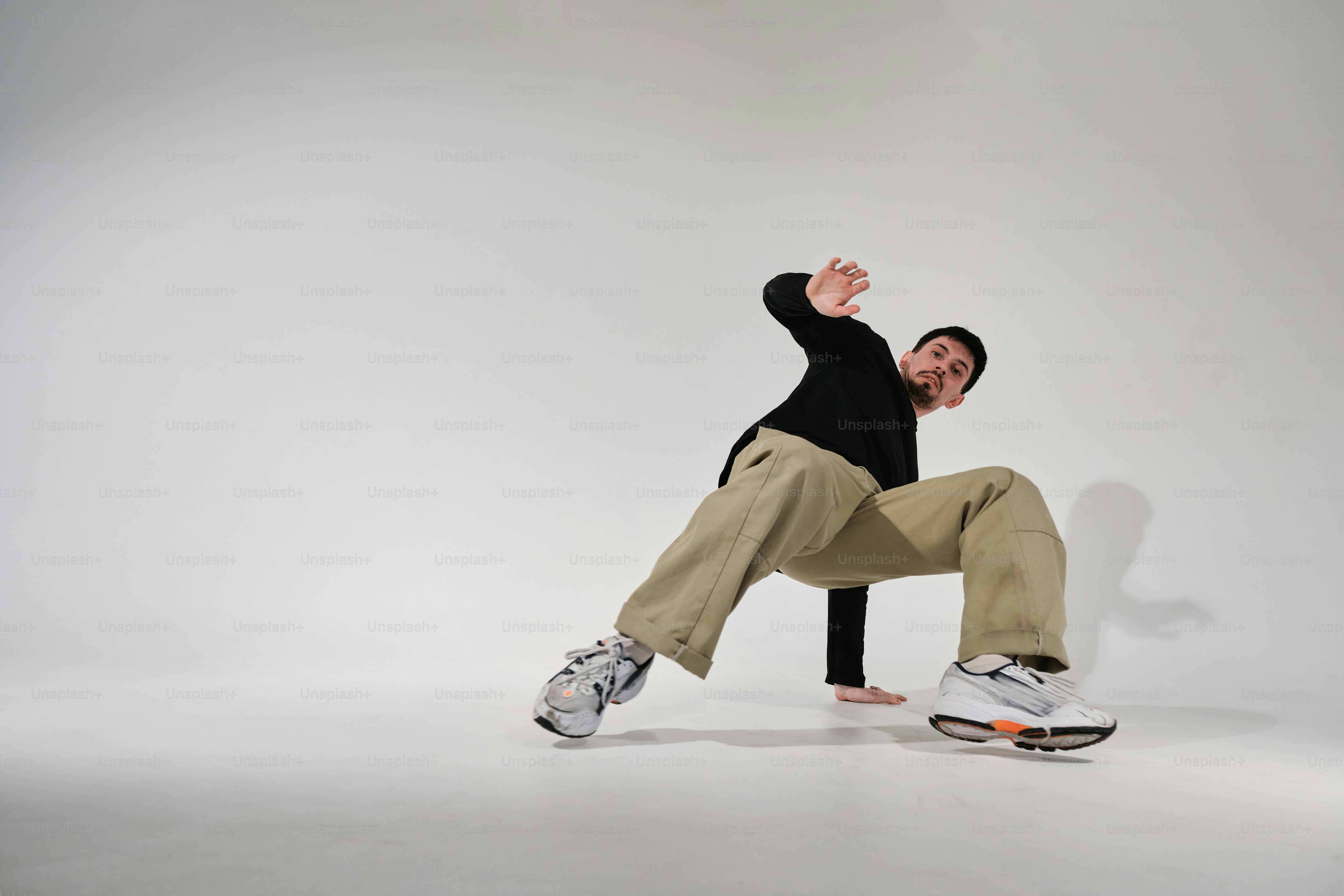 a man in black shirt doing a trick on a skateboard