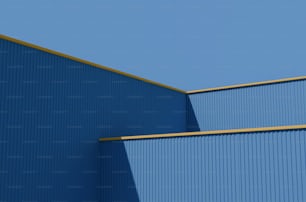 Ein Flugzeug fliegt über ein blaues Gebäude