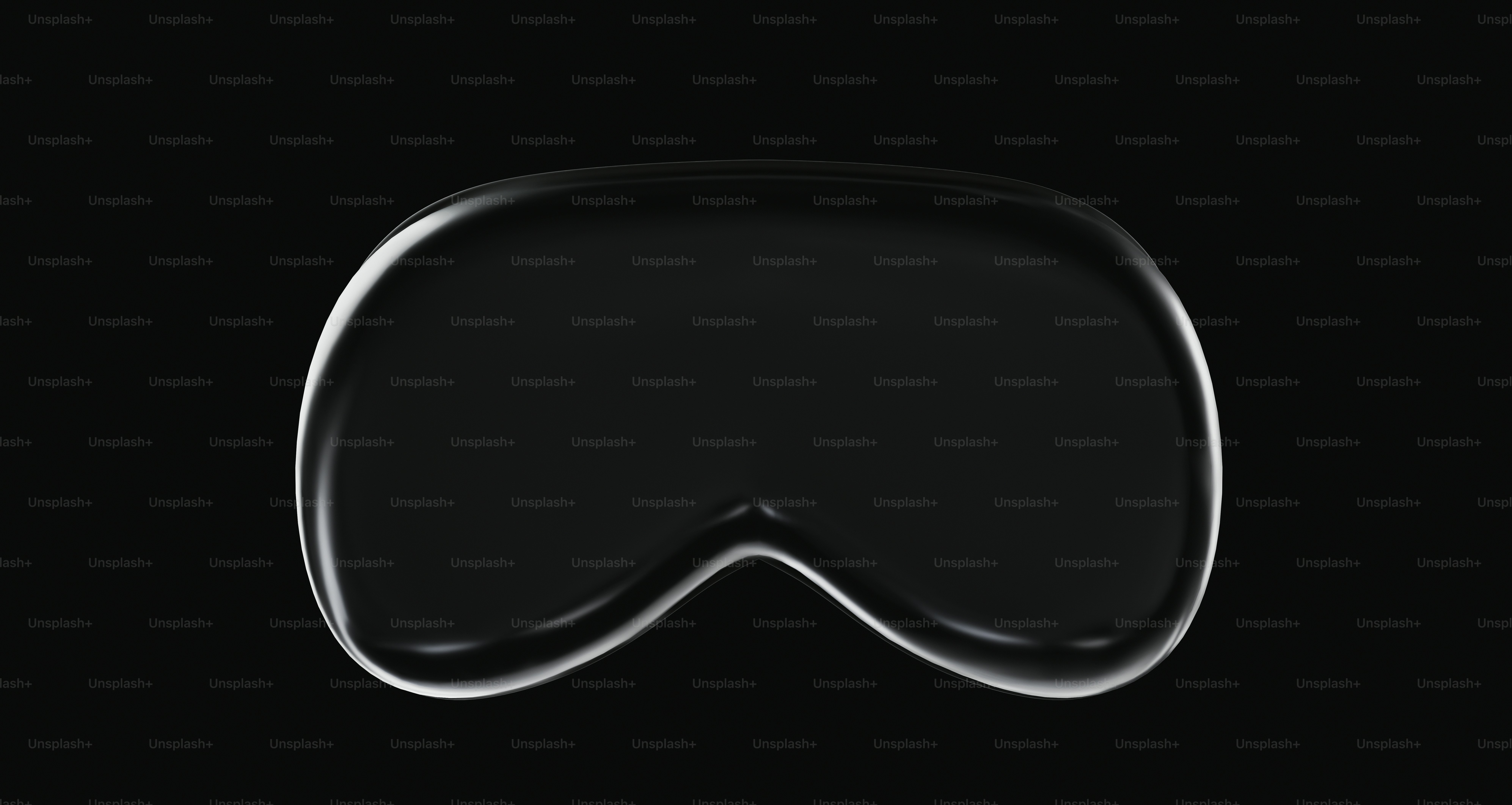 un primo piano di un oggetto nero con uno sfondo nero