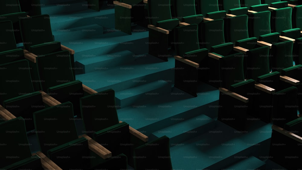 rows of green seats in a theater or auditorium