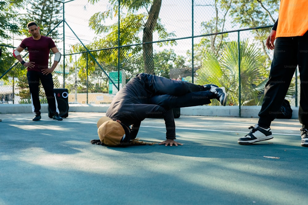 a man laying on the ground with his head on a skateboard