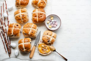 a bunch of hot cross buns sitting on top of a table