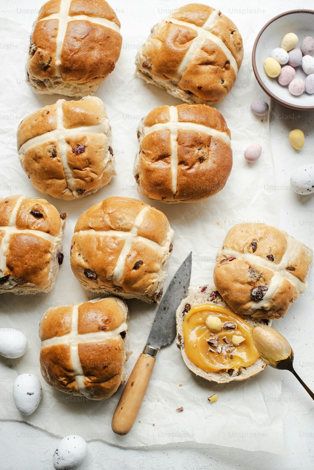 a bunch of hot cross buns sitting on top of a table