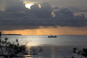 a boat in the middle of a large body of water